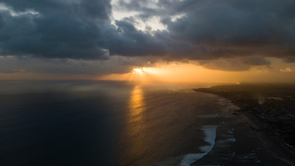 Obraz premium Sunset over sand beach of Changgu area,Bali island,Indonesia