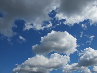 Blue sky with white cumulus clouds