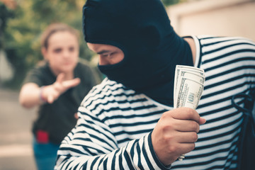 Street Pickpocket is Stealing Money and Backpack Purse From Tourist in The City, Close-Up of Bad...