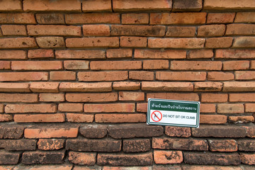 Sign board is do not of ancient ruin statue in Historical Park of Ayutthaya