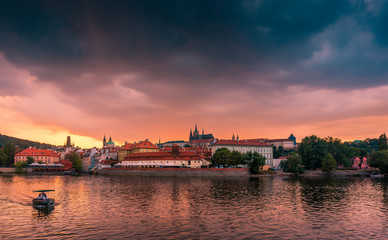 Fototapeta premium Stunning cityscape of Prague on a sunset in Czech Republic. Vltava river, Prazsky hrad (Prague castle).