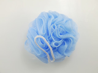 blue plastic bath puff for shower cleaning and scrub body