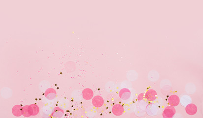 Pink festive confetti background.
