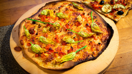 Pizza with pumpkin flowers