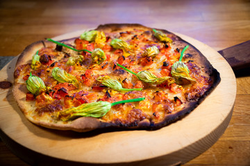 Pizza with pumpkin flowers