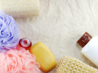 shampoo and liquid shower gel with bath puff and loofah spa kit top view