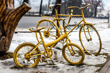 Fototapeta na wymiar Vintage old bicycle colored in gold color.