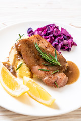 pork steak with red cabbage and mashed potatoes