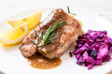 pork steak with red cabbage and mashed potatoes