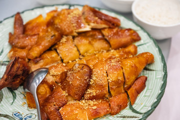 Grilled chopped chicken topped with garlic