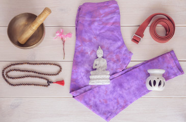 Yoga pants, aroma lamp , statue Buddha , tibetan bowl , wooden mala beads  and yoga strap  on...
