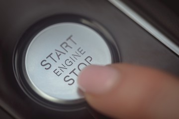 Female executive using starter of car