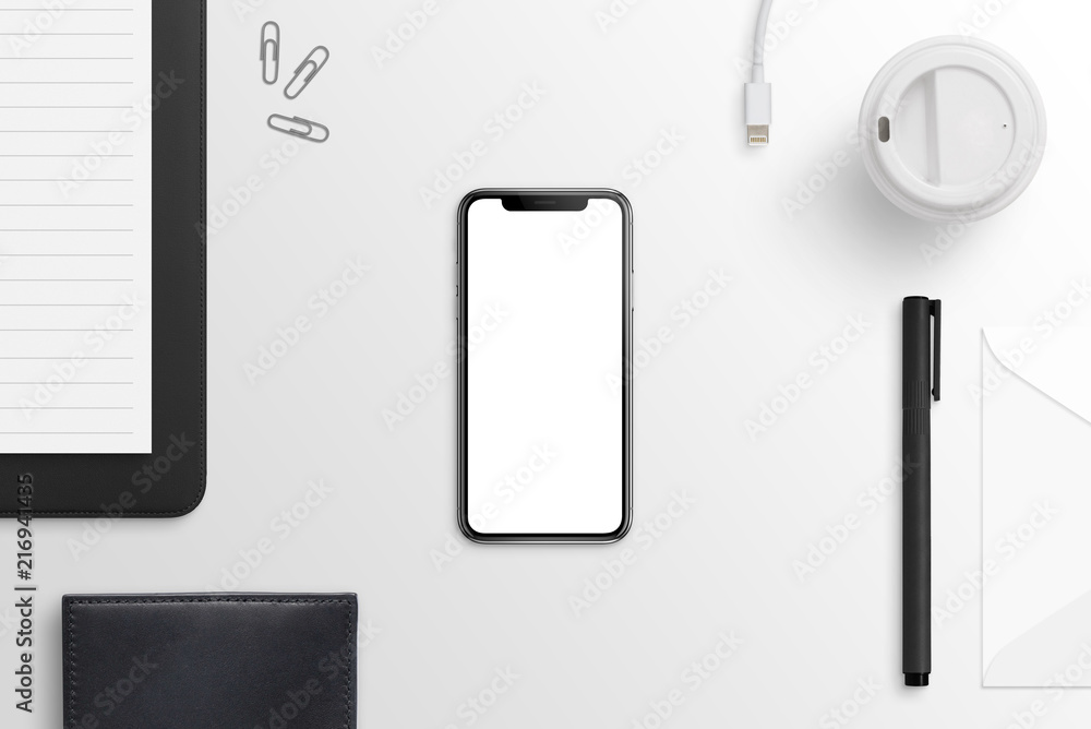Leinwandbilder smartphone with curved display on workdesk. isolaled screen for mockup. flat lay.