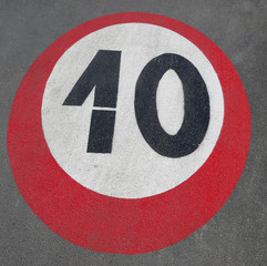 number 10 of a speed limit sign written on the road