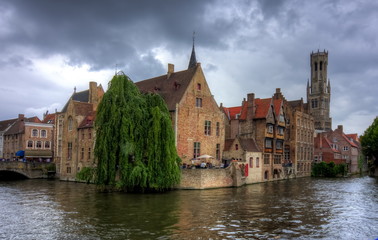 Fototapeta na wymiar Rozenhoedkaai canal and Belfort tower, Bruges, Belgium