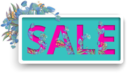 Pink sale carved paper sign with eucalyptus on green background.