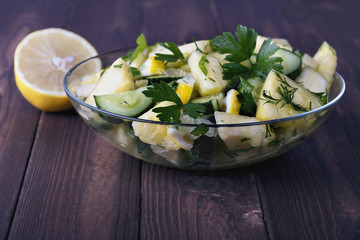 a plate of delicious summer lettuce from pineapple and cucumber closeup