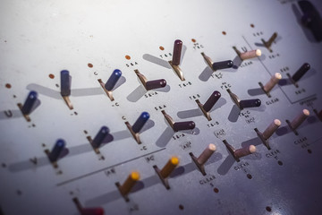 Selective focus, toggle switches on a control panel of electrical logic machine