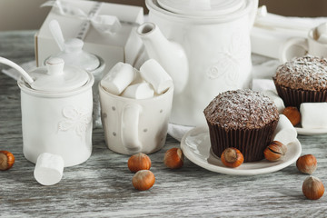 Chocolate cupcakes, marshmallow and different Christmas decorations