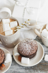 Chocolate cupcakes, marshmallow and different Christmas decorations