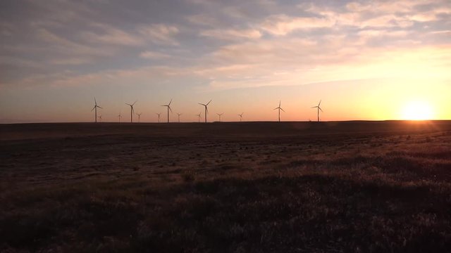 Scenic view of wind turbines power generator, Wind turbines at sunset in the state of Idaho, USA