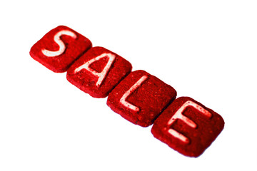 White letters on a chocolate cookie. The inscription 