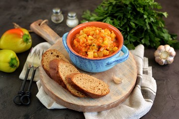 Roasted  bell peppers with onions and carrots in tomato sauce.