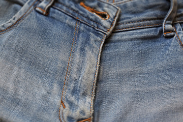 Fototapeta premium macro texture shabby blue denim with yellow stitched thread