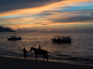 Penang Beach at Sunset with Horse and Boats