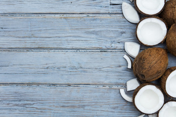 Coconuts on a rustic wooden background.