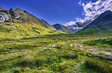 schottish highlands landscape with cloud in the sky.