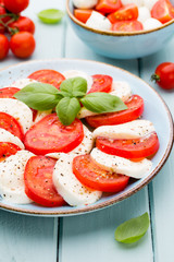 Classic caprese salad. Mozzarella tomatoes and  Basilikum.