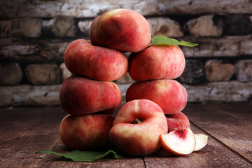 Fototapeta na wymiar Ripe peaches in basket on wooden background