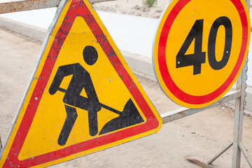 Repair works. Road works and speed limit signs