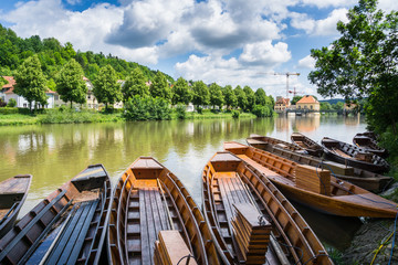 Germany, Many traditional wooden punt boats on Neckar river in Tuebingen City - obrazy, fototapety, plakaty