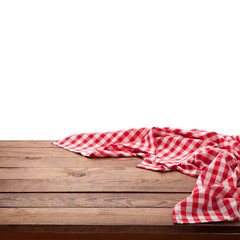 Red checkered tablecloth on wooden table. Napkin close up top view mock up. Kitchen rustic...