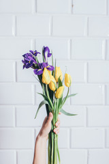 Iris and tulips flowers bouquet of purple and yellow colors