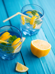 Refreshing lemonade with lemon and mint in glass glasses on the table