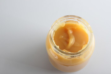 puree baby in a glass on a light background