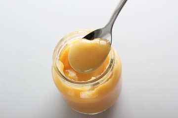 puree baby in a glass on a light background