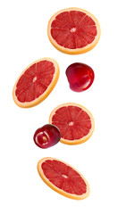 Slices of pink grapefruit and cherry in the fall isolated on white background. A set of fruits and berries.
