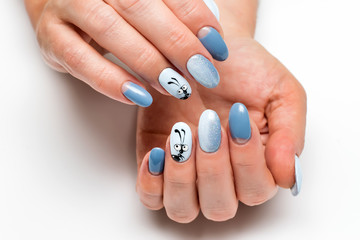 festive blue manicure with sequins on long oval nails with painted ant
