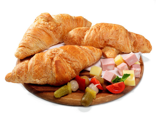 Fototapeta Croissant salati su tagliere di legno