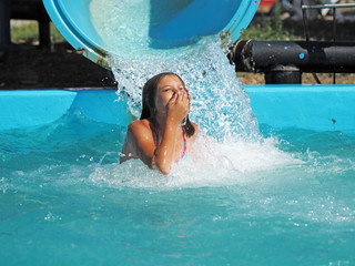 Little girl playing in a water park