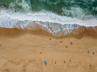 surfers on the waves view from above. Sport concept