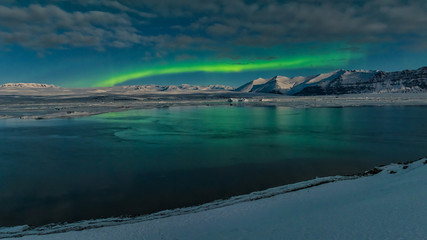 Iceland - Aurora line over Jokulsarlon glacier lagoon