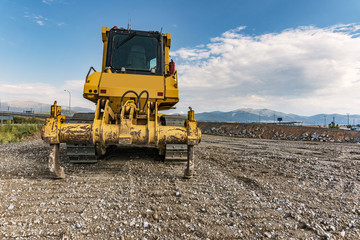 Obraz premium Excavator performing earthworks work in the expansion works of the Madrid-Segovia-Valladolid highway