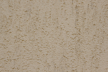 Brown plastered handmade rough wallpaper. Beautiful decorative gray plastered wall.