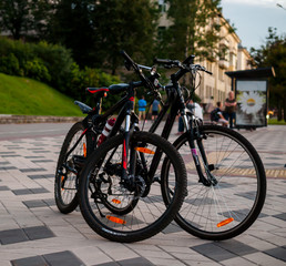 Fototapeta na wymiar Two bicycles on a city street bike trip outdoor activities