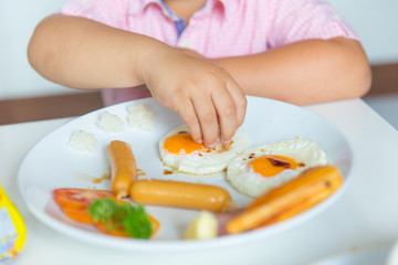 fat boy kid self eating morning meal fried egg healthy food tasty yummy